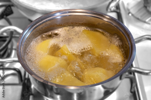 Cooking peeled potatoes in the pot