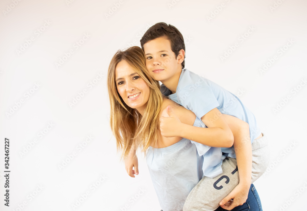 Beautiful woman holding her son on her back Beautiful woman holding her son on her back