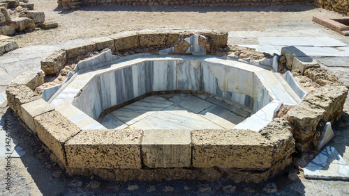 Marble and stone bath embedded into floor, Caesarea, Israel