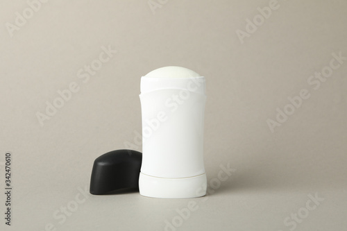 Body deodorant on gray background, blank space for text