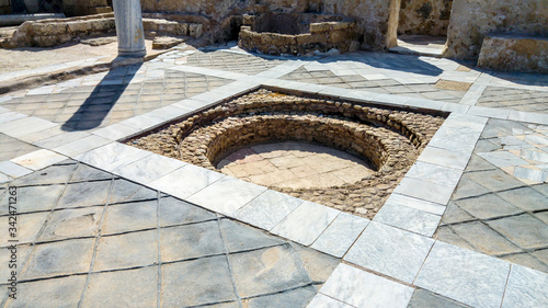 Marble and stone bath embedded into floor, Caesarea, Israel