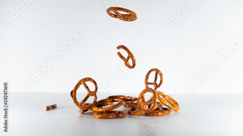 
Bretzels, delicious Alsatian salted cookies, falling in cascade, on white background photo