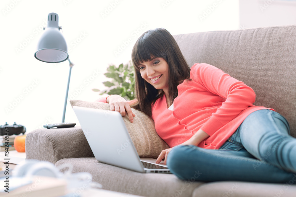 Young woman connecting with a laptop Young woman connecting with a laptop