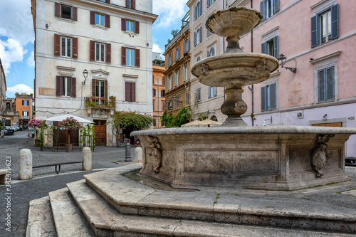 Rome, Italy - The characteristic Piazza della Madonna Dei Monti with the ancient Catechumen Fountain, built in 1588.