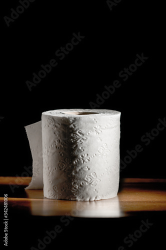 toilet paper roll on black background