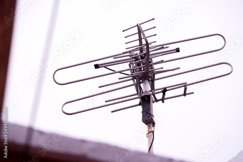 Antenna on house roof in Guatemala, Latin America, obsolete technology, analog TV, communication and entertainment