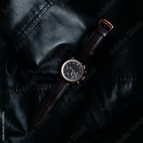 Gold LEATHER WATCH, VINTAGE STYLE WRIST WATCH, MEN'S LEATHER WATCH on leather background blur.