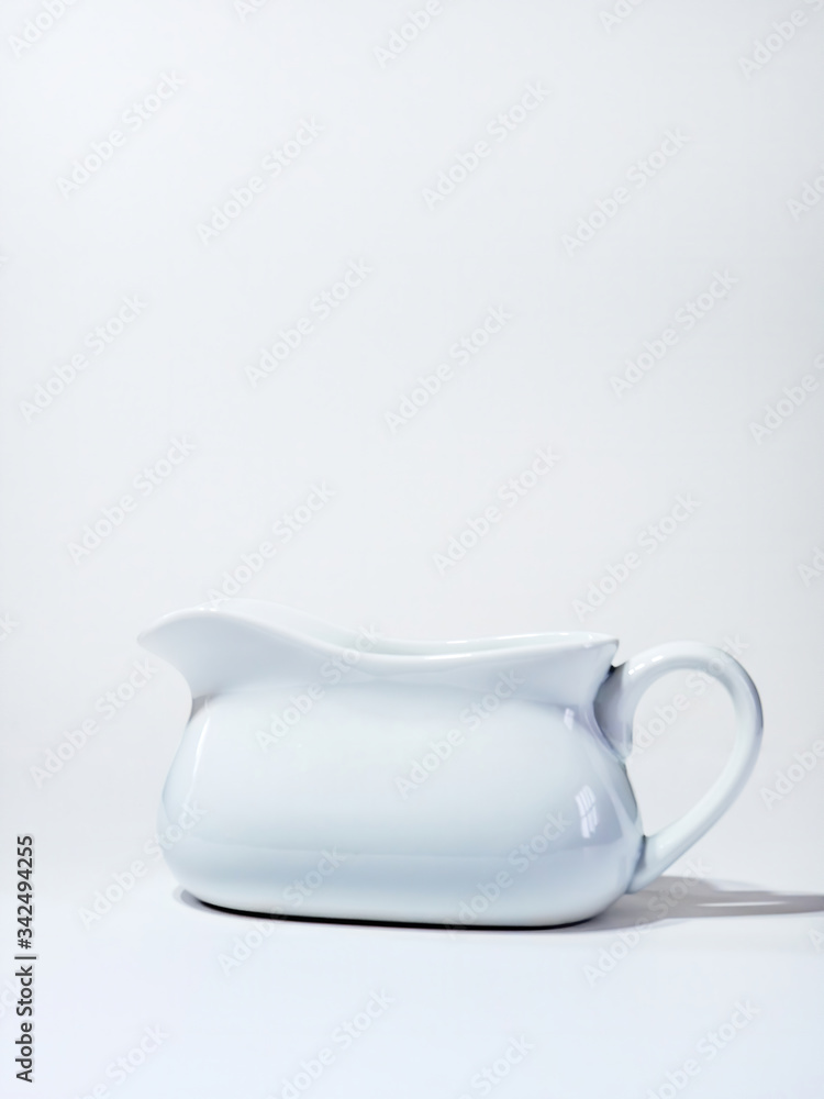 Obraz white ceramic gravy boat on white background