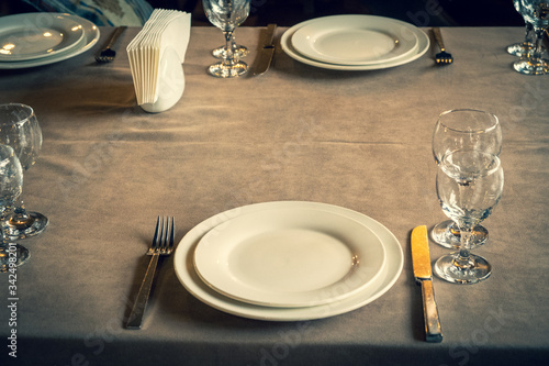 Wallpaper Mural The served table in the restaurant. Clean dishes and appliances on the tablecloth in a cafe. Shiny transparent glasses. White plates. Prepared for the reception of guests. High service. Torontodigital.ca