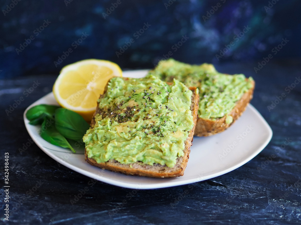 avocado toast on a dark background
avocado toast on a dark background
