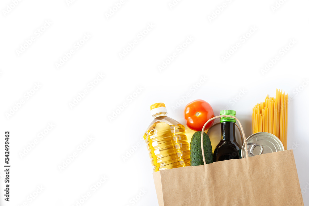 Donation volunteer box with various products. Food set in a box on white background. Free space for text copy space Donation volunteer box with various products. Food set in a box on white background. Free space for text copy space