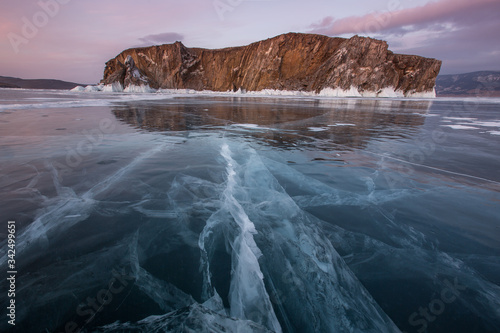 Lake Baikal. Rocky island in the ice on a sunny day