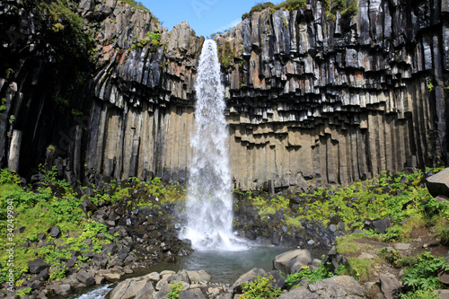 Skaftafell / Iceland - August 18, 2017: The black waterfall of Svartifoss in Skaftafell National Park, Iceland, Europe