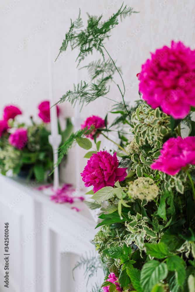 Naklejka premium composition of bright pink peonies and greenery