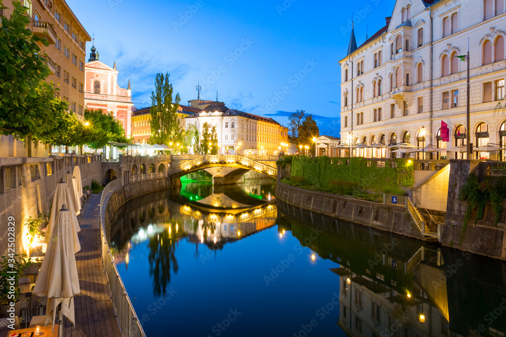 Naklejka premium Reflection in Ljubljanica river and surrounded buildings