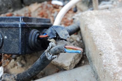 Unsafe condition of electric cable. No insulation and exposed outdoor. 