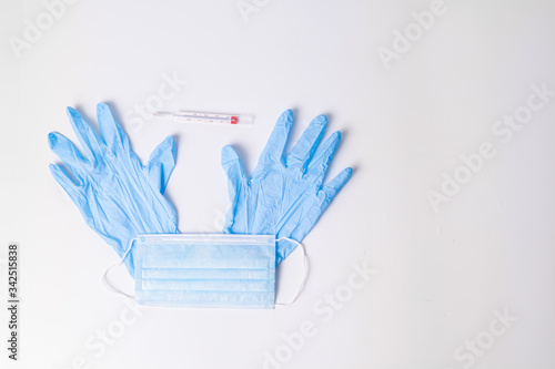 nitrile gloves with hydroalcoholic gel surgical mask and thermometer