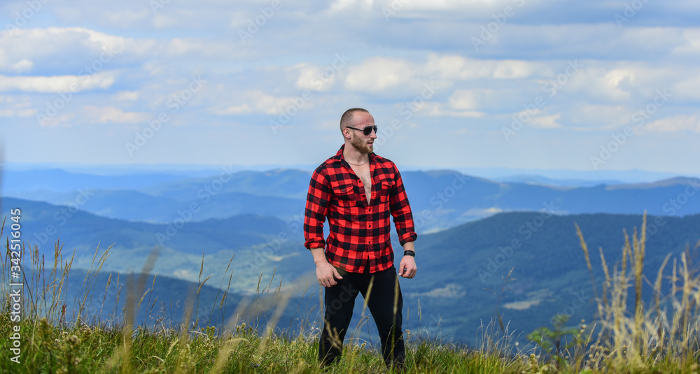 Man stand on top of mountain. Hiking concept. Active leisure. Guy enjoy freedom. Discover world. Masculinity and male energy. Achieve freedom. Free and wild. Value of freedom. Self sufficient Man stand on top of mountain. Hiking concept. Active leisure. Guy enjoy freedom. Discover world. Masculinity and male energy. Achieve freedom. Free and wild. Value of freedom. Self sufficient