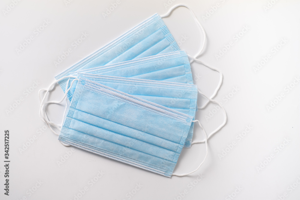 several blue surgical masks several blue surgical masks