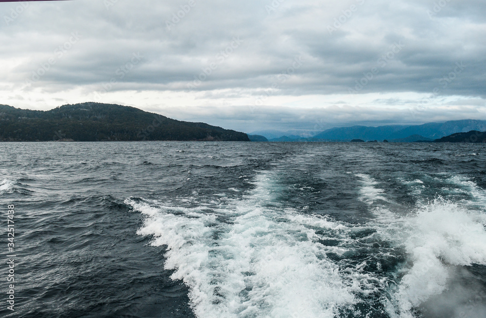 landscape from a boat in the sea, with background of mountains and snow landscape from a boat in the sea, with background of mountains and snow