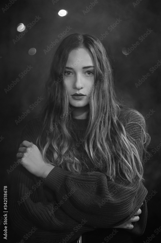 Fototapeta premium Black and white portrait of a woman in smoke