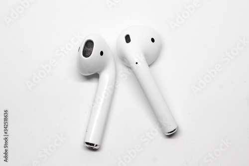 White wireless headphones closeup on a white background