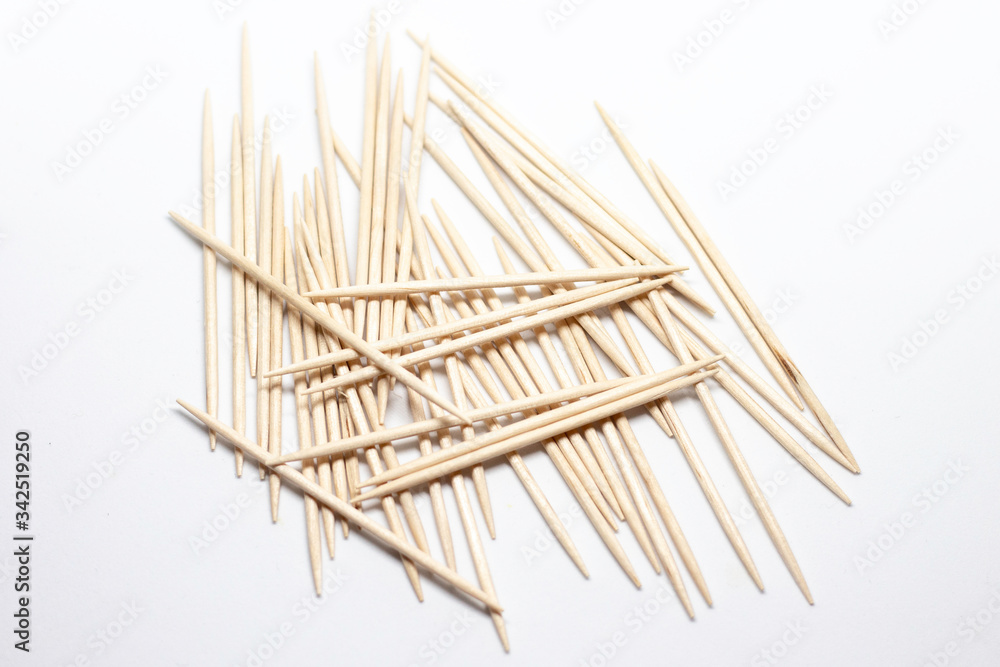 Wooden toothpicks on a white background Wooden toothpicks on a white background