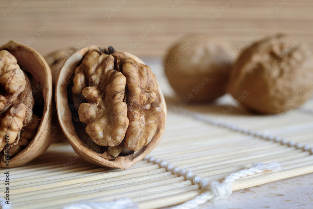 Peeled walnuts on the kitchen table, close up. Peeled walnuts on the kitchen table, close up.
