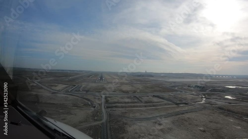 The plane is landing on the runway. Video recording from the cockpit. 4K resolution. Clean image. Video recording from the cockpit of the passenger plane. Daytime shooting. photo