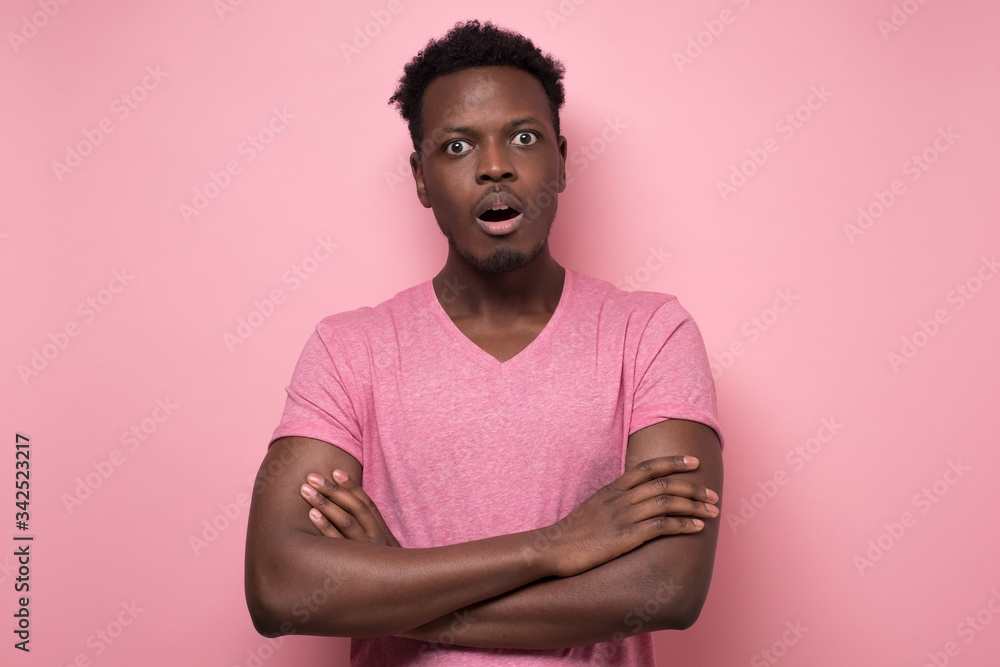 african american man looking at the camera in surprise, stunned with a story african american man looking at the camera in surprise, stunned with a story