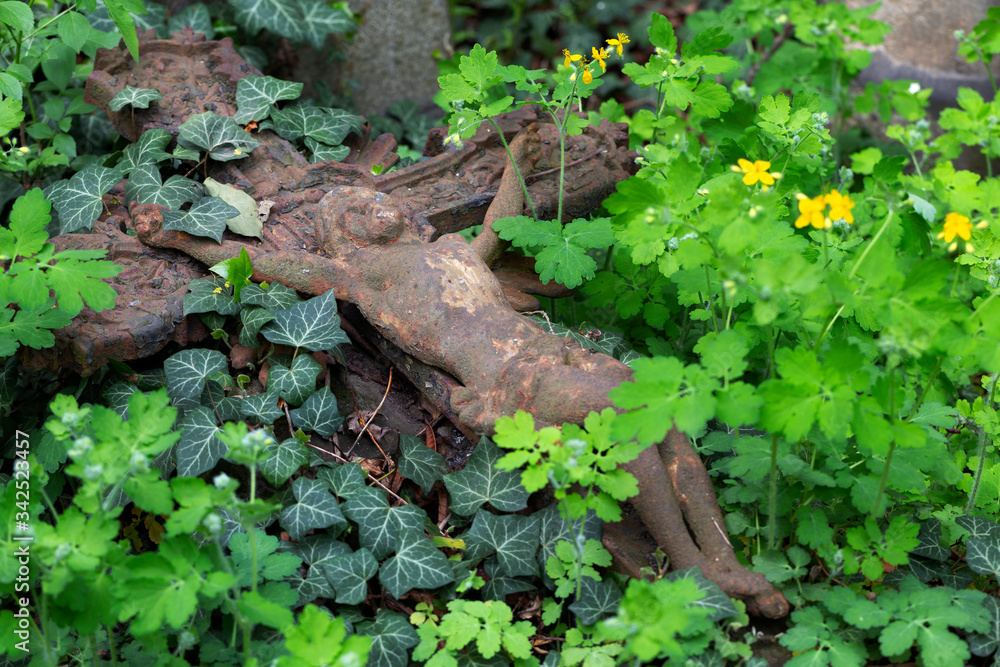 Historic Statue on the spring mystery old Prague Cemetery, Czech Republic