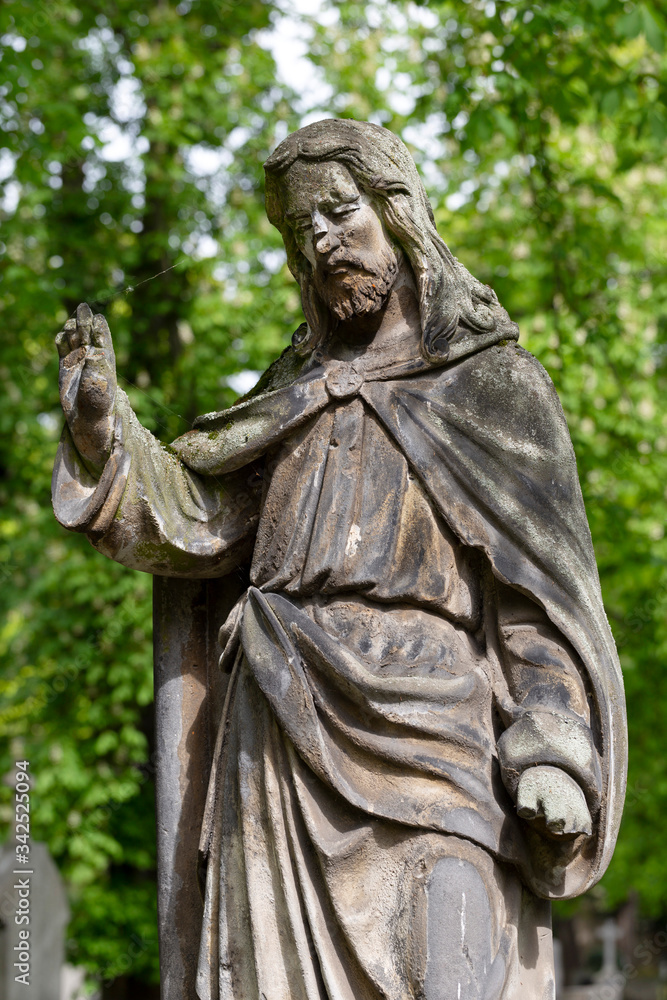 Historic Statue on the spring mystery old Prague Cemetery, Czech Republic