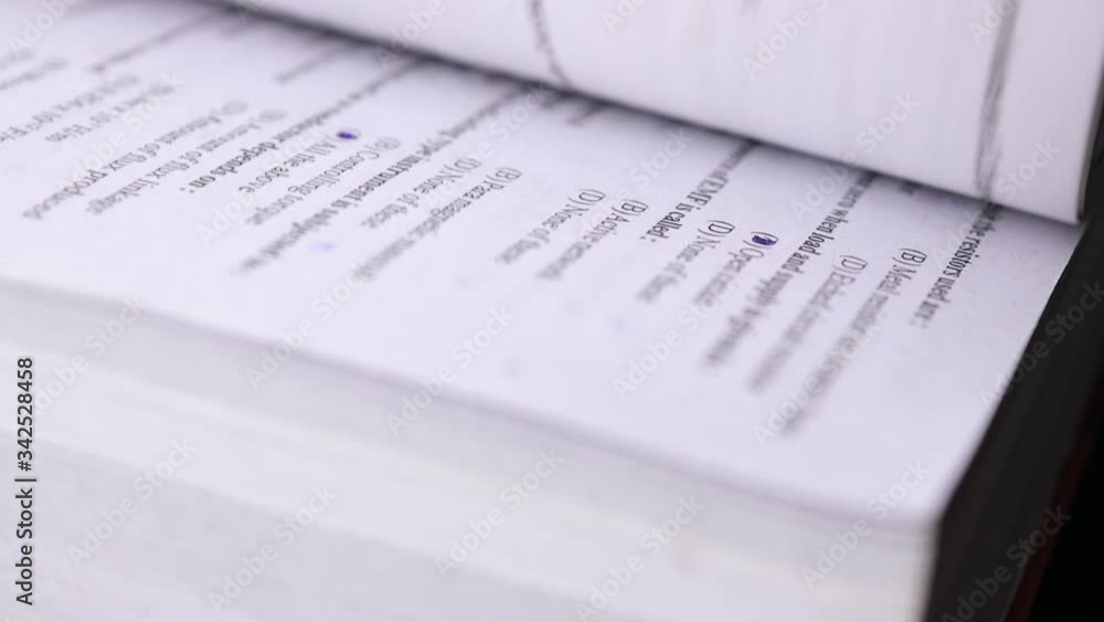 4K flipping book pages close up. Looking through a book turning the pages and reading - Business and education concept 4K flipping book pages close up. Looking through a book turning the pages and reading - Business and education concept