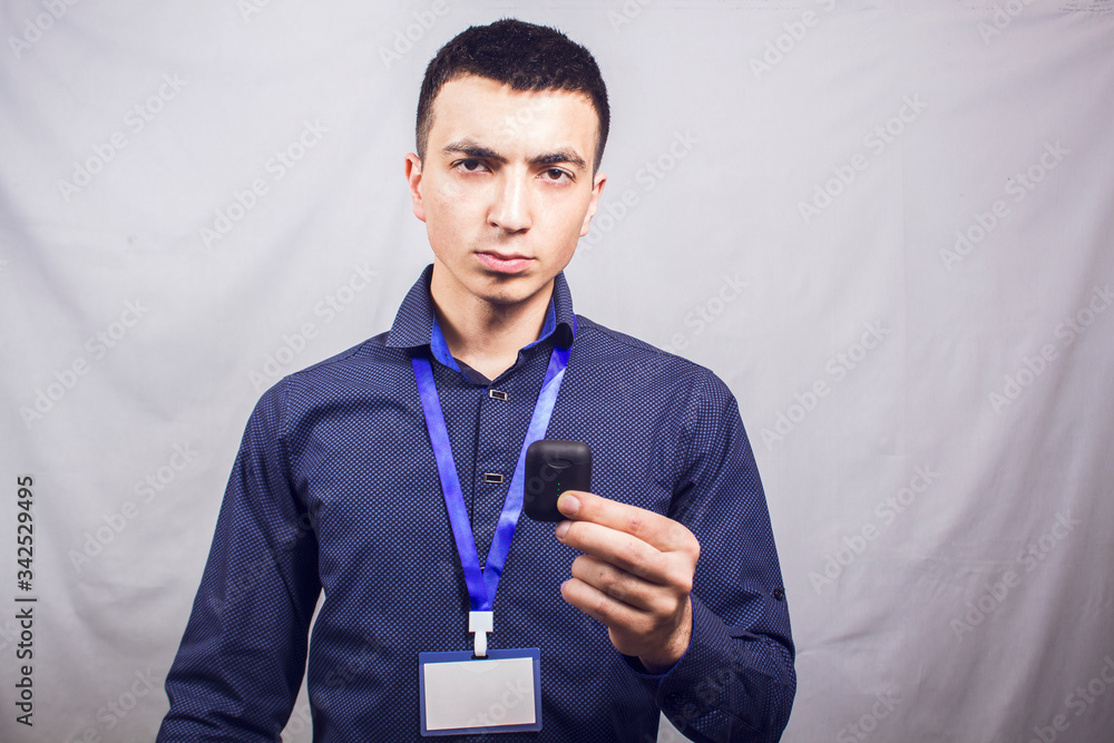 wireless headphones in hand