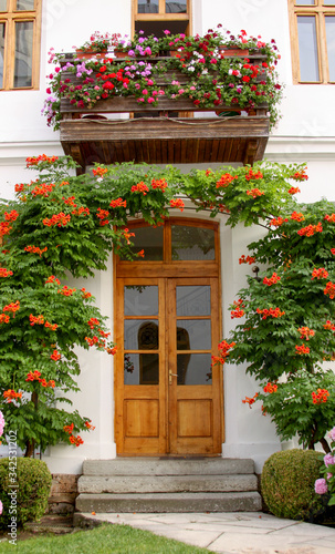 Door entry into house from garden with flowers
