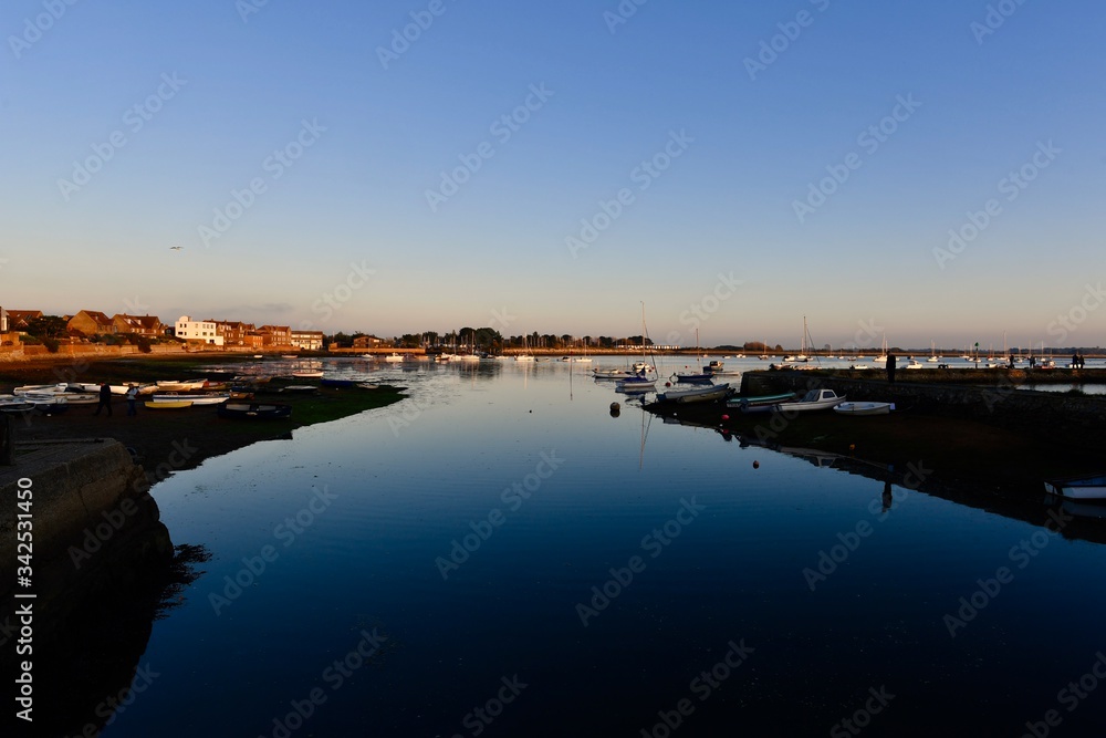 Mirror water at dusk at Emsworth harbour