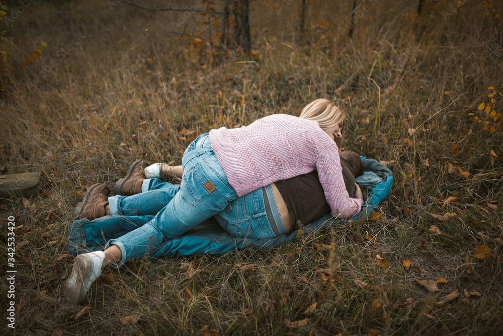 Couple Have Fun While Lying On Sleeping Bag Couple Have Fun While Lying On Sleeping Bag