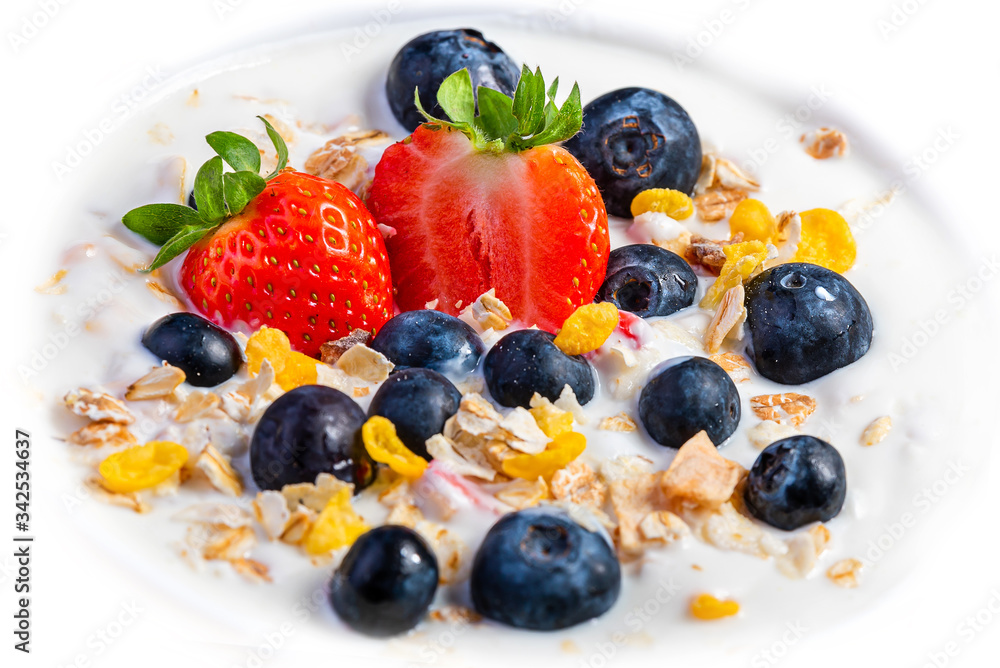 Yogurt with granola, strawberries and blueberries. Yogurt with granola, strawberries and blueberries.