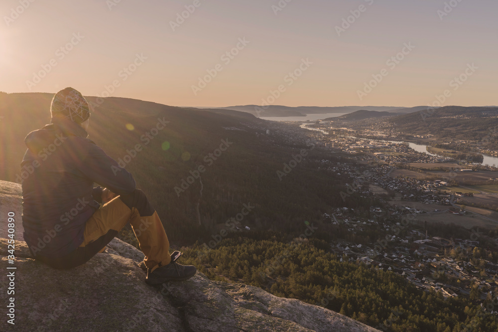 Fototapeta premium Sitting on the rock and watching morning view.
