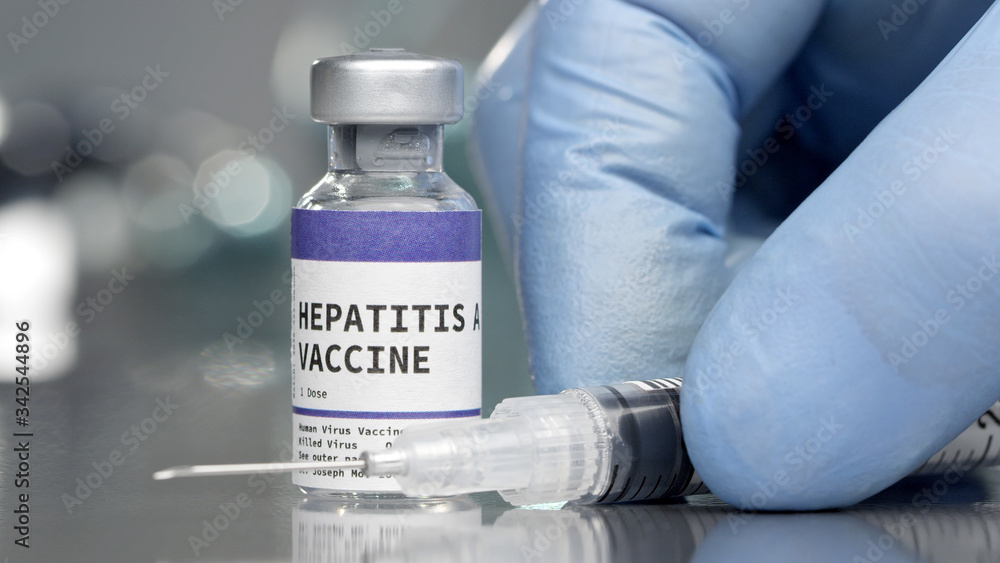 Hepatitis A vaccine vial in medical lab with syringe Hepatitis A vaccine vial in medical lab with syringe