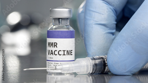 MMR vaccine vial in medical lab with syringe photo