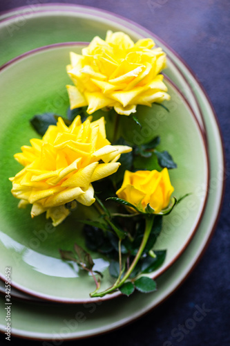 Rustic table setting with yellow roses
