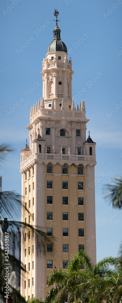 Fototapeta premium Vertical panorama Miami Freedom Tower on blue sky
