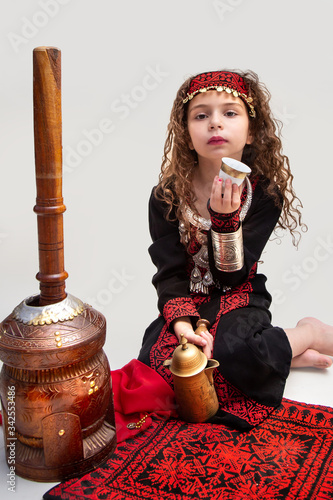 Arabian adorable girl in bedouin traditional cloths 