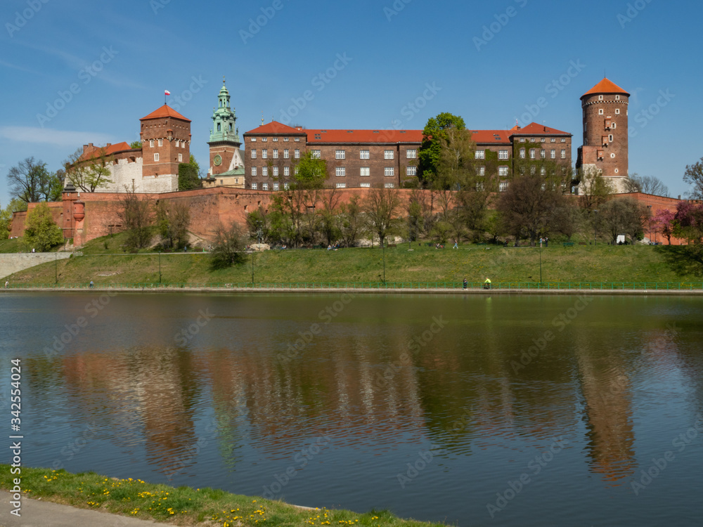 The former Royal residence of Polish monarchy, Wawel Castle, Krakow, Poland. Spring time, view from the Vistula river boulevard.
