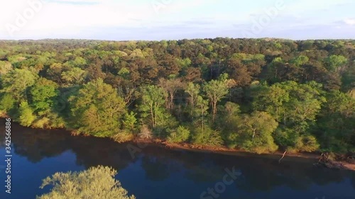Camera rise above trees see River