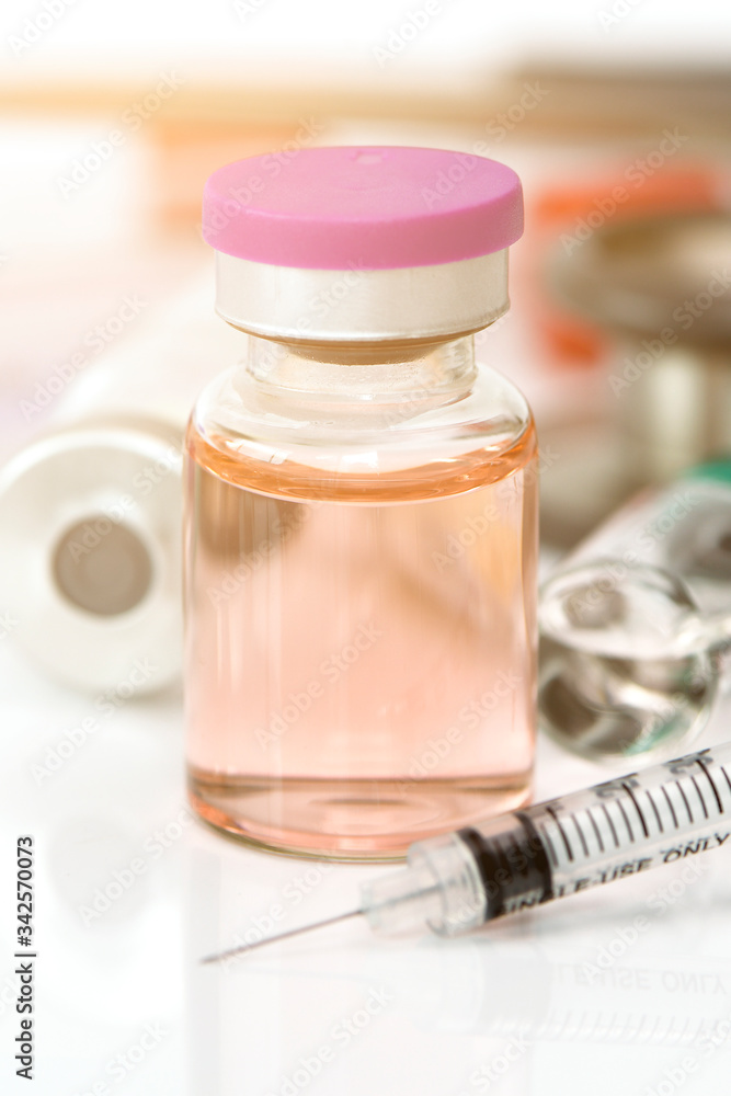 Glass container filled with sterile injection solution. Glass container filled with sterile injection solution.