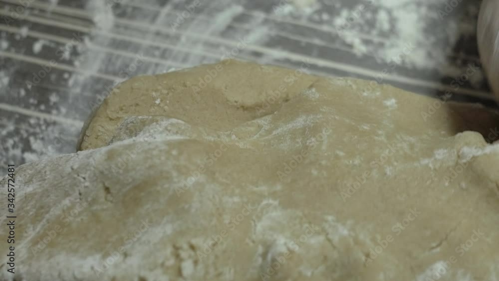 Woman kneading dough preparing tasty cookies for Christmas Woman kneading dough preparing tasty cookies for Christmas