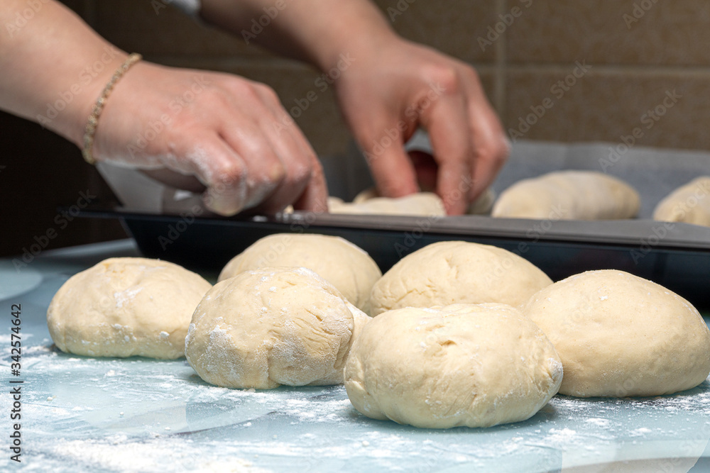 woman makes dough for making bread at home woman makes dough for making bread at home