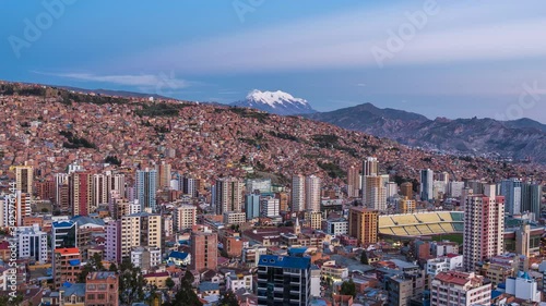 La Paz, Bolivia, day to night timelapse view of cityscape and Illimani mountain. photo